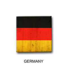 Germany flag on a wooden block. Isolated on white background. Signs and symbols.