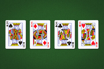 Four kings, on a green background. Gambling.