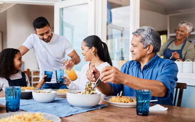 Fototapeta na wymiar What did you put in these. Shot of a happy family having lunch together at home.