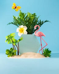 Summer weekend party concept. Flamingo, palms, tropical flowers and butterfly on blue background.