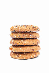 Stack of cookies with different seeds, multigrain. Isolated on white background. Healthy food