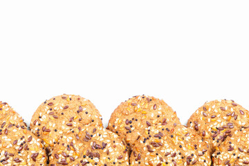 Cookies with different seeds - sunflower, flax, sesame and quinoa, multigrain. Isolated on white background. Healthy food