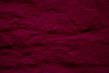Crimson colored wall background with textures of different shades of crimson red