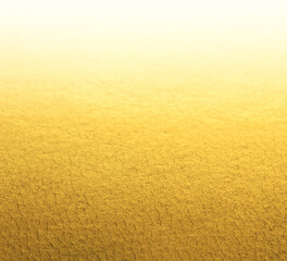 gold abstract background with soft glowing backdrop texture for christmas and valentine.