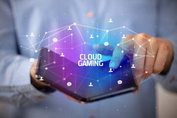 Businessman holding a foldable smartphone, new technology concept