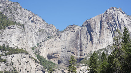 El Capitan and Half Dome granite monolith mountain peaks in the Yosemite National Park of California, USA.