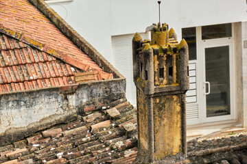 Openwork traditional chimney on a roof in Silves, Algarve, Portugal