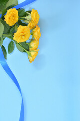 Yellow roses on a blue background