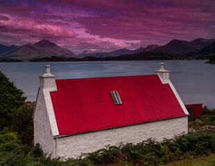 House by the sea with a red roof © Jaroslaw