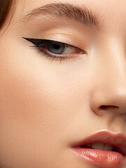 Closeup of beauty woman with clean shiny skin and natural cosmetics. Beautiful extrem eyelash and...