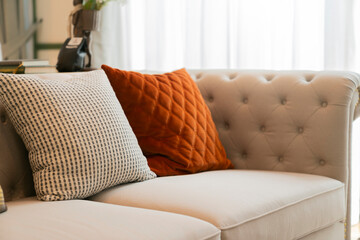 close up decorative pillow cushion arrange with pattern on soft beige sofa couch in living room...