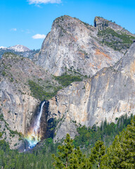 Rainbow at Bridalveil Falls and Cathedral Spires, in Yosemite National Park, near Merced, California.