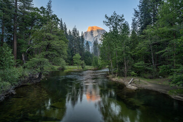Last light on Half Dome and the Merced River from Sentinel Bridge, in Yosemite National Park, near Merced, California.
