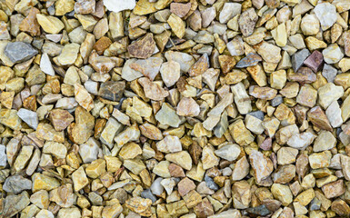 Grey Granite Chipping. Crushed Stones Background copy space. Decorative Garden pebbles. Top view building industry 