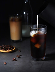 Cold coffee with ice in low key	