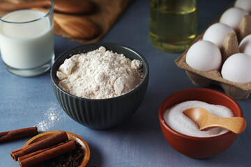 Food ingredients for baking: flour, eggs, milk, sugar