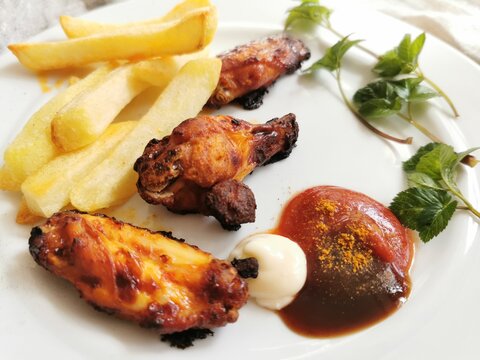 grilled chicken wings and french fries