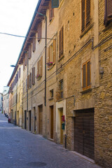 Fototapeta na wymiar Street with historical old buildings in downtown of Pesaro