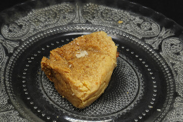 sweet in a plate. on a black background