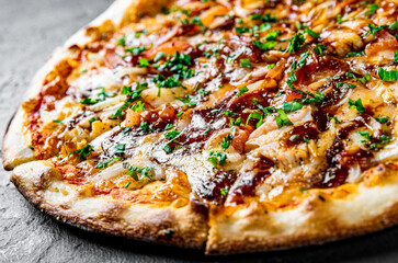 Pizza with chicken and barbeque sauce . Italian pizza