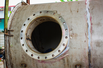Manhole open lid stainless steel tank chemical methanol testing.