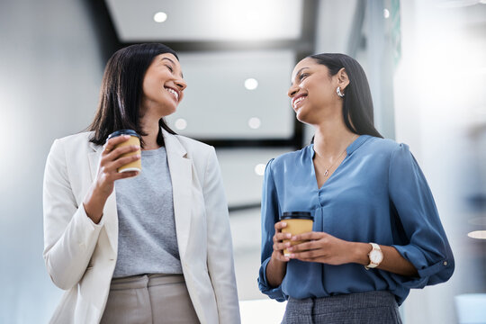 They Told Us That We Couldnt, So We Did. Shot Of Two Businesswomen Holding Coffees While Talking In An Office.