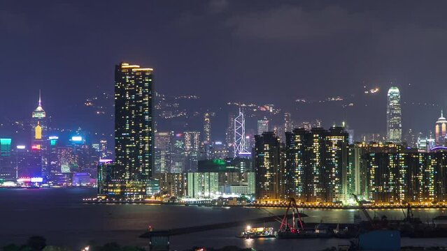 Top view of Hong Kong at night, aerial view from kowloon bay downtown timelapse