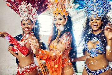 Making it a carnival to remember. Shot of beautiful samba dancers performing at a carnival.