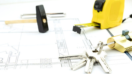 House keys and roulette on the drawings. the concept of construction and purchase of new housing