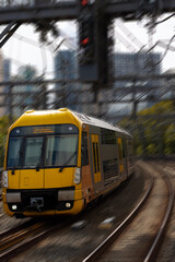Naklejka na ściany i meble Commuter train approaching a train station in Sydney NSW Australia