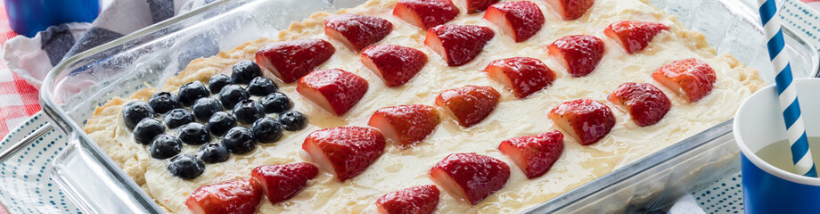 Narrow view of a stars and stripes cheesecake for a 4th of July celebration.