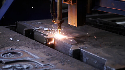 Laser plasma cutting of metal . Clip . Colorful production process at a metallurgical plant .