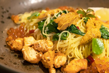 Capellini chili salmon roe and sea urchins. Premium delicious meal.