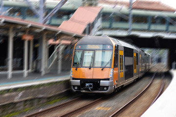 Commuter train approaching a train station in Sydney NSW Australia