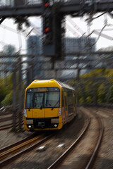 Commuter train approaching a train station in Sydney NSW Australia