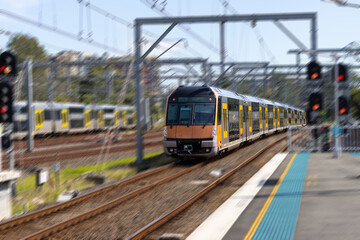 Fototapeta na wymiar Commuter train approaching a train station in Sydney NSW Australia