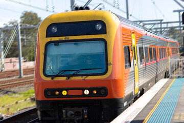 Naklejka premium Commuter train approaching a train station in Sydney NSW Australia
