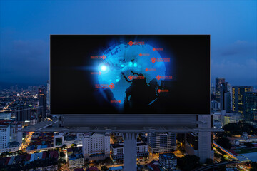 Hologram of Earth planet map on billboard over night panoramic cityscape of Kuala Lumpur, Malaysia, Asia. The concept of international companies in KL. Globe