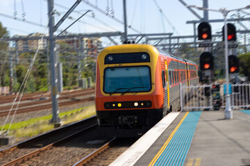 Plakat Commuter train approaching a train station in Sydney NSW Australia