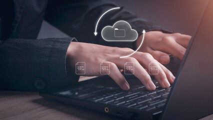 Document Management Data System (DMS) concept. Businessman working with laptop computer with cloud and document icons on virtual screen upload, download.