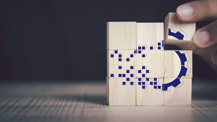 Digital transformation and new era of innovation concept. Hand put gear transform to digital icon in wood block on with Copy space.