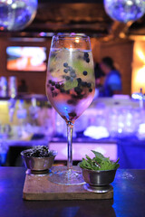 One alcoholic cocktail in a nightclub