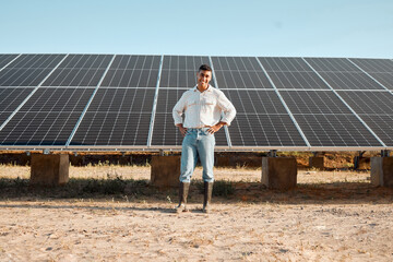 Technology making farming easier. Shot of a young man standing next to a solar panel on a farm. © Kay Abrahams/peopleimages.com