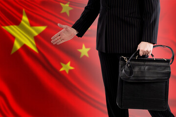 China politician on background of Chinese flag. Portrait of China politician without face. He makes...