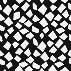 Pieces of white fragments scattered on a black canvas. Seamless and the simplest pattern of angular broken fragments. Vector seamless alligator skin.