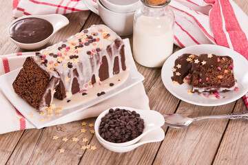 Sponge cake with white frosting and sugars.