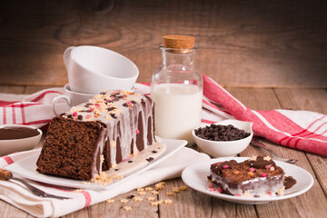 Sponge cake with white frosting and sugars.