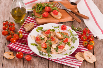 Friselle with cherry tomatoes and arugula.