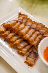A crispy and delicious Chinese traditional Cantonese dish with crispy skin and pork belly