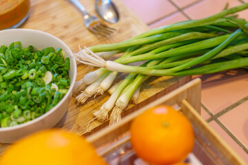 Close-up of food preparation with various asian ingredients and sauces.